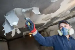 worker cleaning fire mold