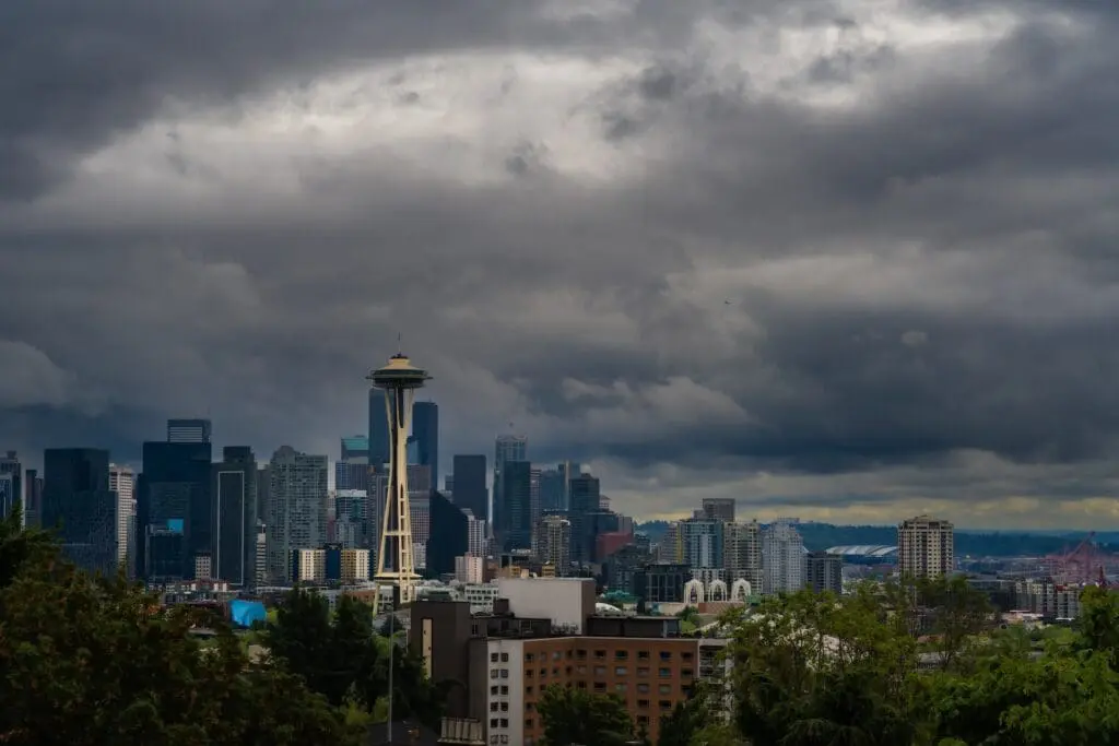 Beautiful view of the downtown Seattle skyline from Queen Anne Hill with dark storm clouds